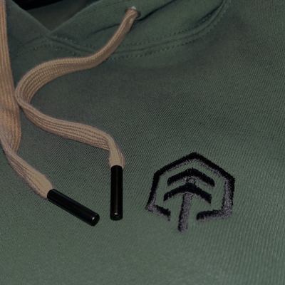 Green hoodie tan drawstrings and metal tips on drawstrings